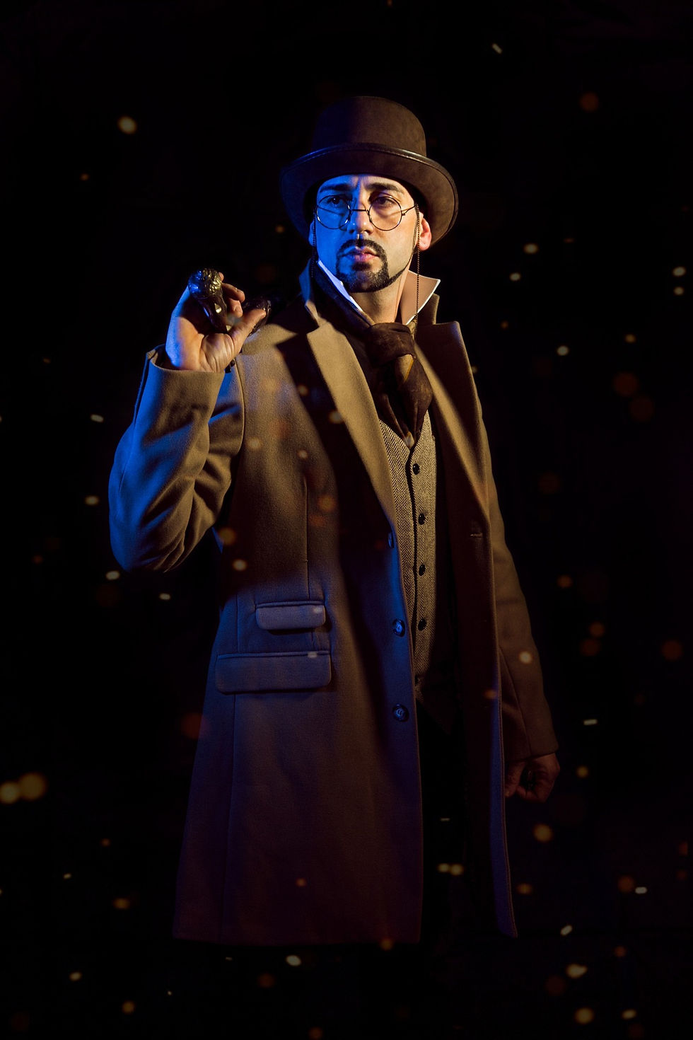 A character wearing a hat and glasses, holding a gun.