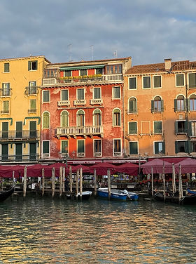Old red and orange buildings along the Grand Canal in Venice, Italy
