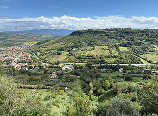 Green Umbrian hillside and village as seen from the hilltop town of Orvieto, Italy