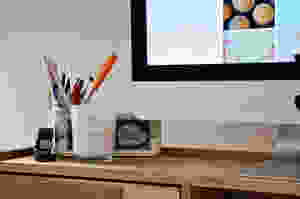Office desk showing an un-lit scented candle