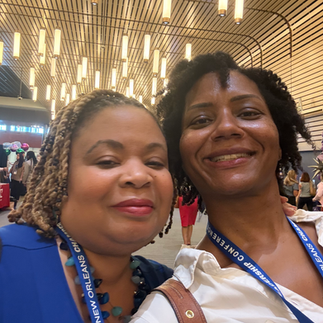 women taking a selfie at a conference