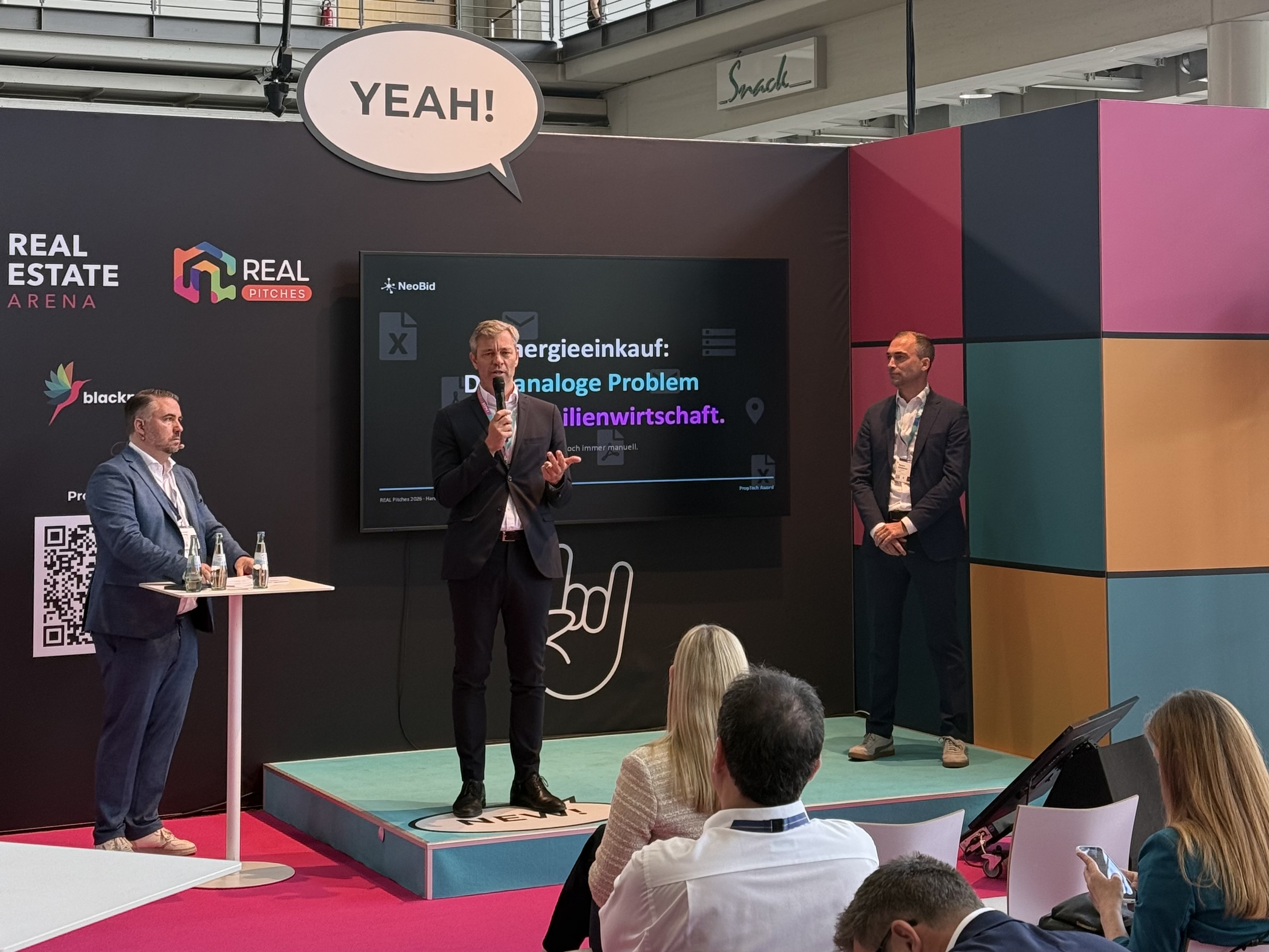 A presentation on energy procurement at Real Estate Arena 2026 in Hanover.