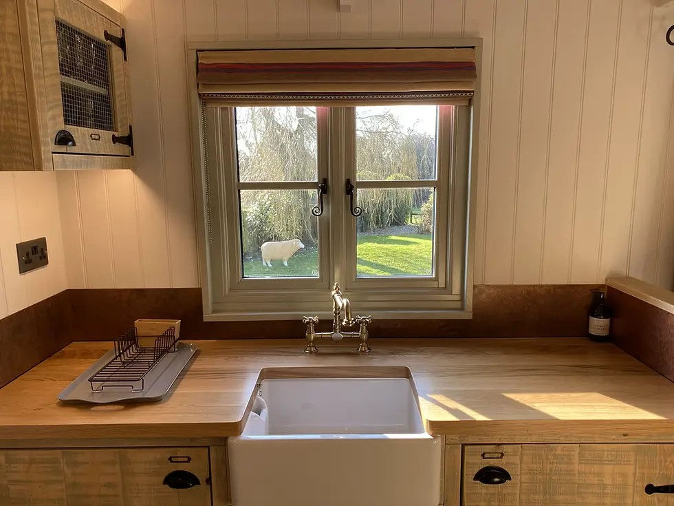 Shepherds Hut accommodation kitchen sink & window