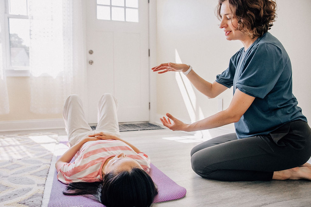 Working with the breath is a common way to build coping skills and teach the nervous system to calm in dance/movement and other somatic therapies. Kimberly Bevans (right) of Be Moved Therapy is pictured with fellow dance/movement therapist and dancer Yu-Ling Hu.