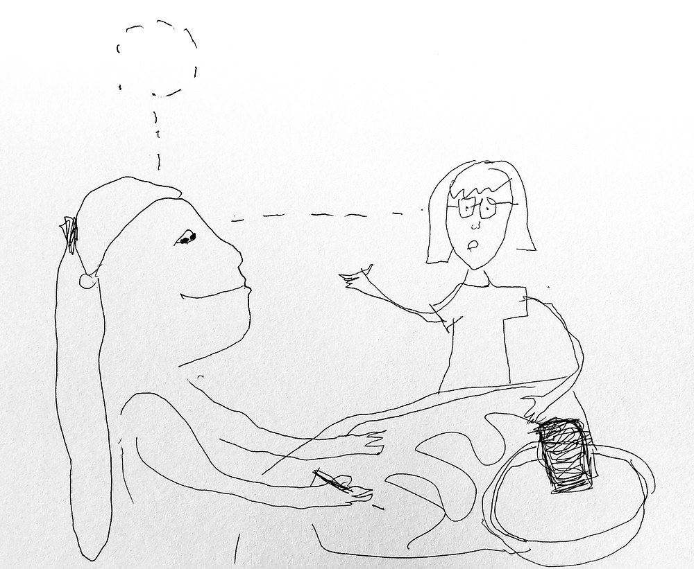 Two individuals work together at a table