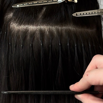 a neat row of pearl keratin bonds freshly installed