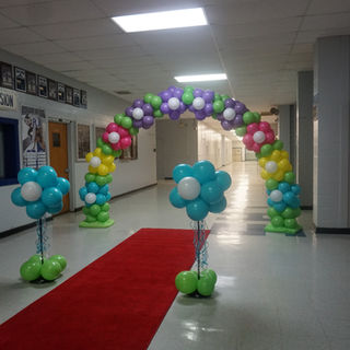 Spring flower arch and flowers school.JPG