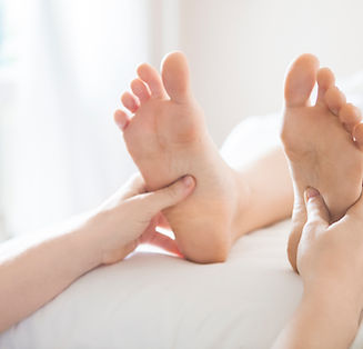 Feet having reflexology treatment