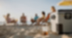 People with ice chest and drinks on the beach