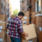 young guy facing backwards moving boxes .jpg