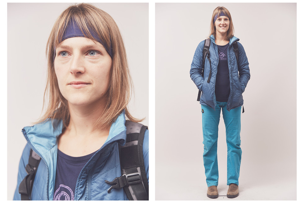 Female climber wearing a 3rd Rock t-shirt and a backpack stands for a portrait at the Women's Climbing Symposium.