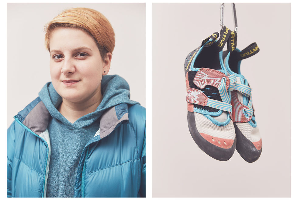 Portrait of woman climber with short hair and their La Sportiva climbing shoes, take at the Women's Climbing Symposium.