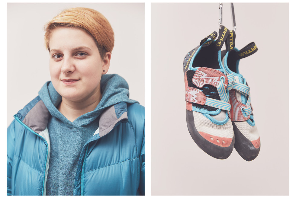 Portrait of woman climber with short hair and their La Sportiva climbing shoes, take at the Women's Climbing Symposium.