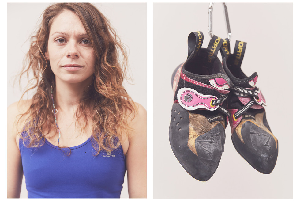 Portrait of a woman climber wearing a Domyos vest and their La Sportiva climbing shoes, taken at the Women's Climbing Symposium.