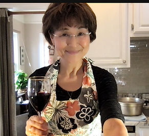 Yoshimi holding a glass of wine