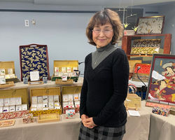 Yoshimi in a booth 6