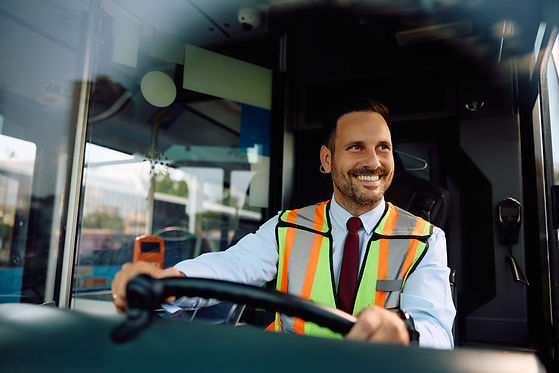 Happy man working as bus driver .jpg