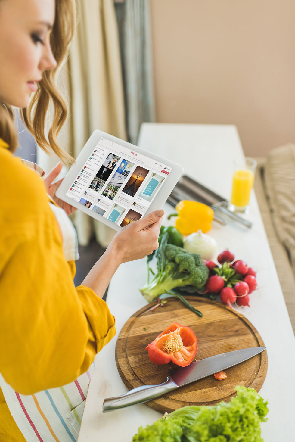 woman-using-digital-tablet-in-kitchen-for-recipe-2024-11-16-00-55-00-utc.jpg