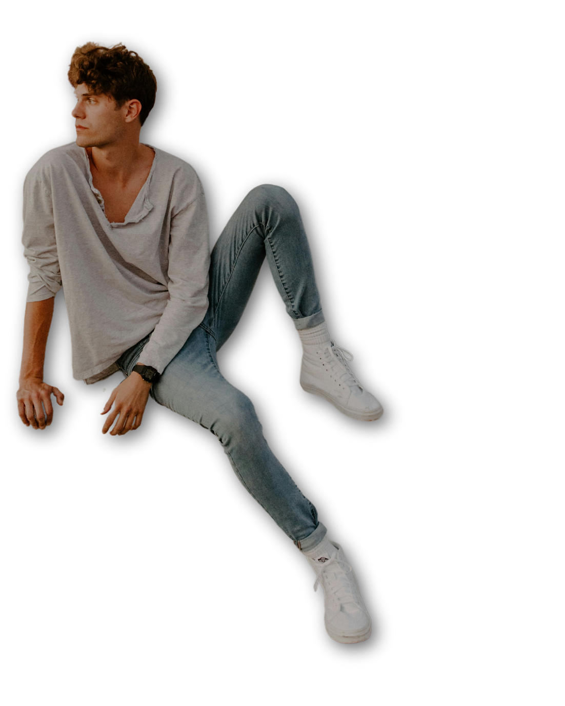 Man in blue jeans looking to side