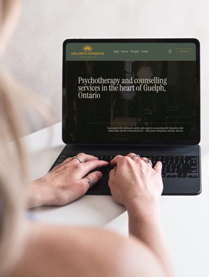 A Canadian therapy website designer typing on her ipad showing a Guelph therapist's website homepage