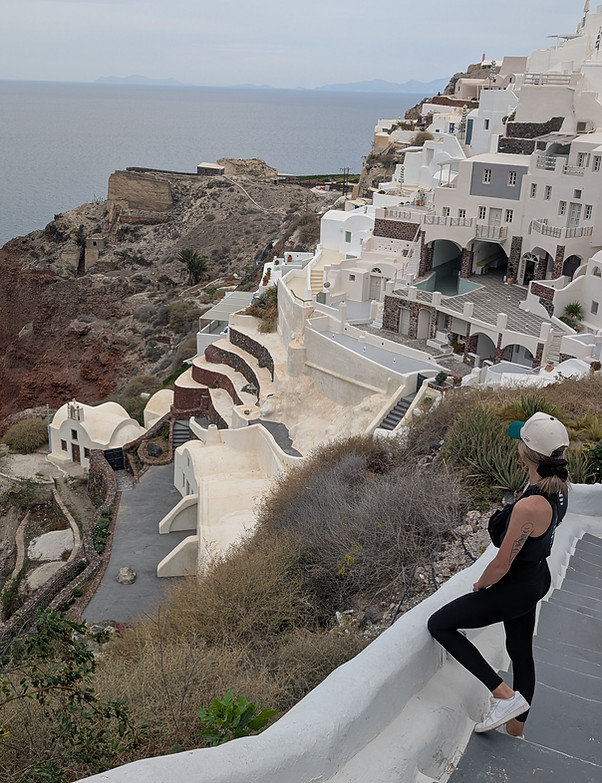 A website designer + SEO expert for therapists in Canada looking at the coast of Santorini