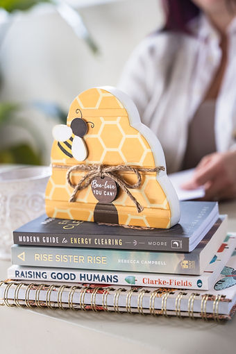 Yellow wooden beehive on a therapist in Brantford Ontario's desk.