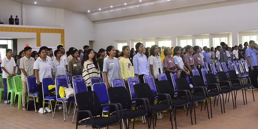 Eye-level view of Aula Komodo conference hall filled with young participants