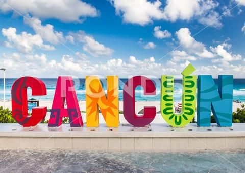 CANCUN inscription in front of the Playa Delfines beach Stock Photo #73323825