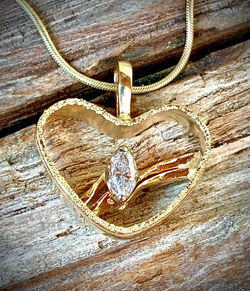 Heart Wedding Pendant was created after a spouse passed and they were fashioned into one.