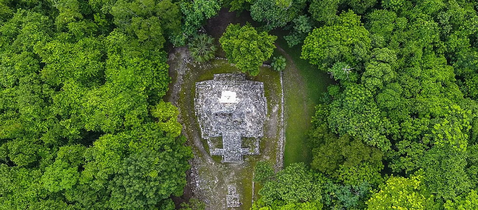 Aerial view of the Muyil archaeological structure surrounded by dense tropical jungle within the Sian Ka’an Biosphere Reserve in Quintana Roo, Mexico.