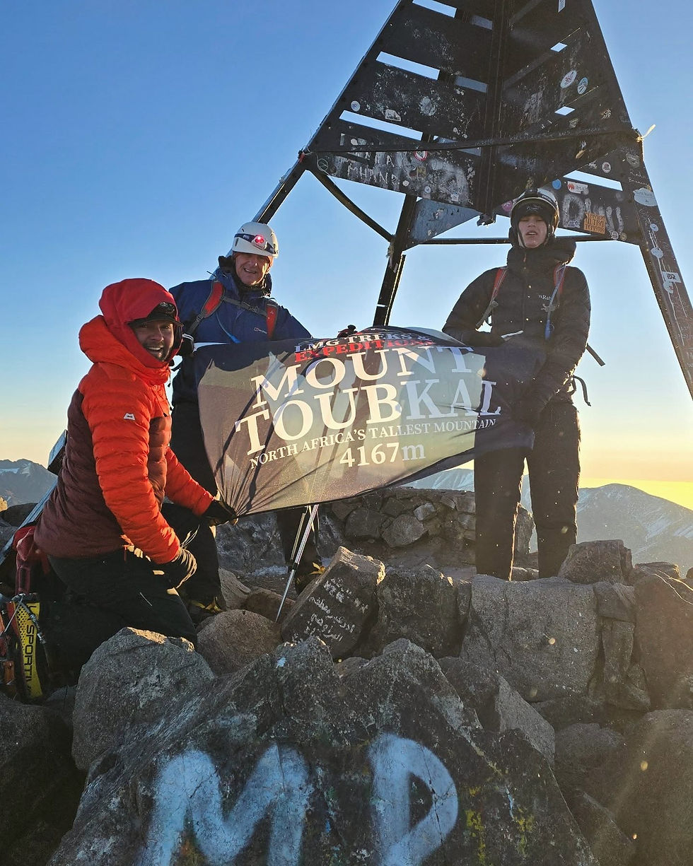 Mount Toubkal Summit in Winter. Left to Right: Matt, Paul, Owen
