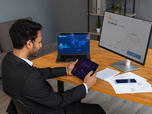 A person using Account Management Software on laptop