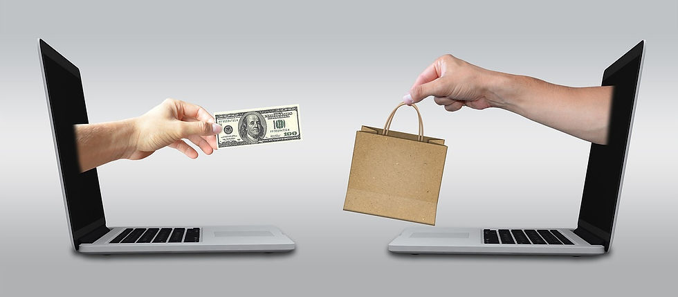 A conceptual representation of eCommerce, showing two laptops facing each other. One hand extends from a laptop screen holding a dollar bill, while another hand emerges from the opposite laptop offering a brown shopping bag, symbolizing online transactions.