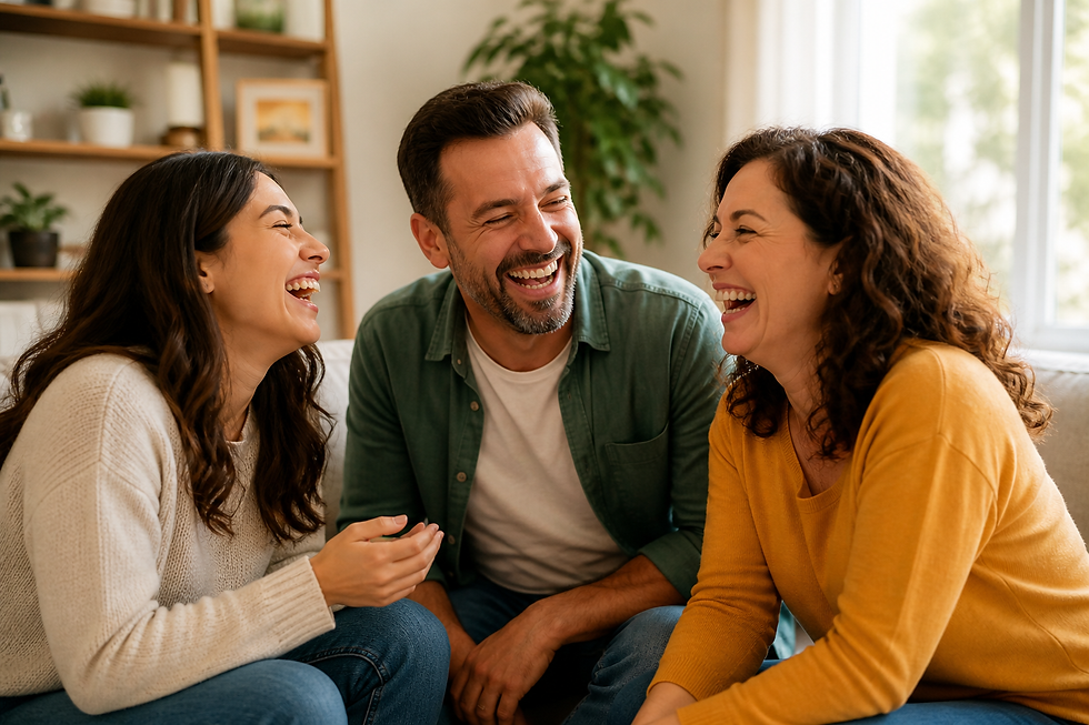 People laughing together in a warm, natural setting showing the mental and physical health benefits of laughter
