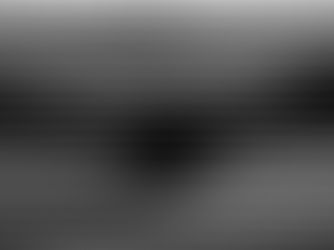 Silhouette of two people shaking hands in front of window blinds