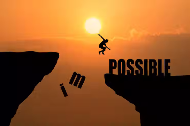 A person is jumping across a gap between two cliffs at sunset, with the word "impossible" split so that the "im" is falling away, transforming the word into "possible" on the other side, symbolizing overcoming challenges and turning the impossible into possible
