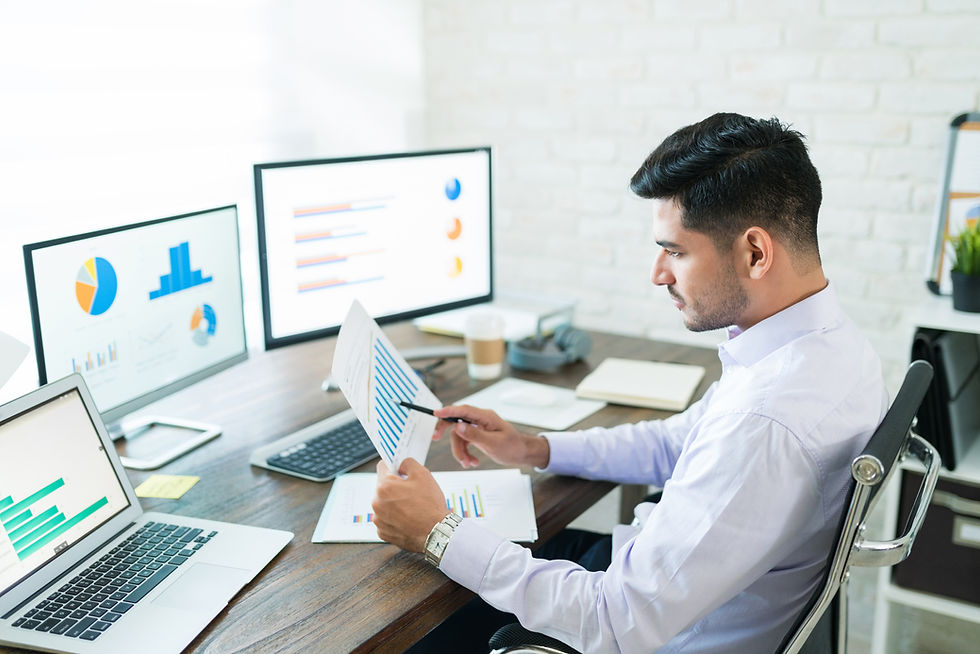 handsome-latin-businessman-examining-sales-data-while-working-home