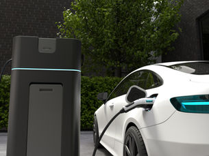A sleek white electric vehicle charging at a modern charging station, highlighting the advancements in clean energy and the growing adoption of electric vehicles.