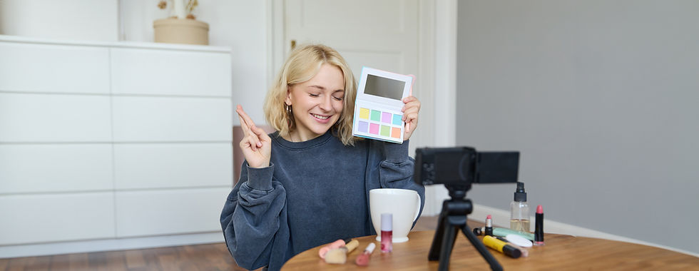 A beauty influencer recording a video with makeup products, showcasing product demonstrations and tutorials for social media content creation.