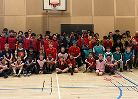 group photo of volunteers and young people at sports plus xtra