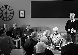 golfers listening to Howard Bennett