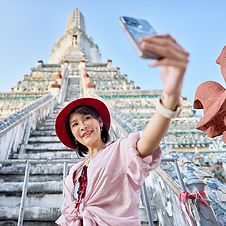 happy-thai-woman-taking-seflie-at-wat-arun-temple-2023-11-27-04-56-19-utc square.jpg