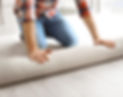 Man%20rolling%20out%20new%20carpet%20flooring%20in%20room_edited.jpg