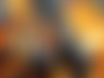 metal pipes laying on top of a fire pit with flames starting to touch the pipes.