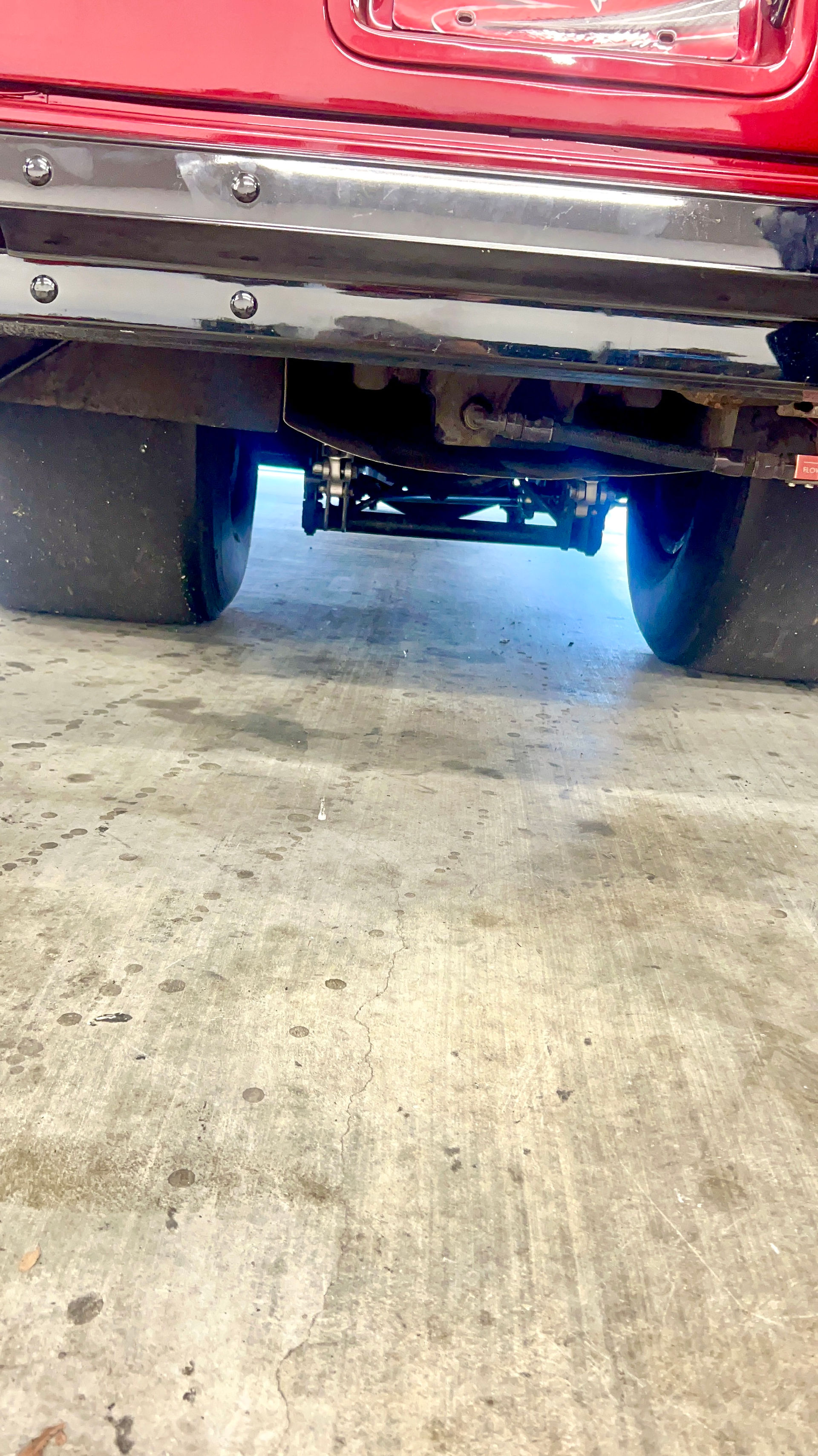 race car being repaired and welded on site at the race track