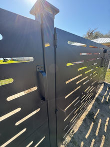 a custom made gate design with cutouts in a pattern
