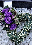 real holly heart with purple rose arrangement