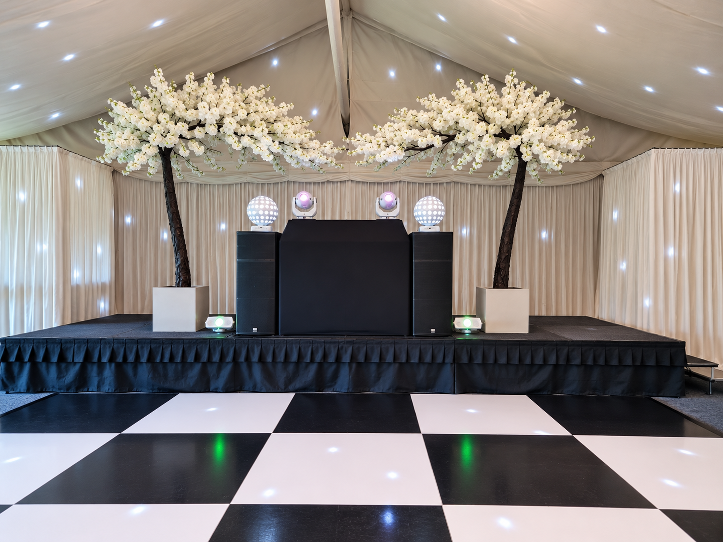 White DJ Prestige booth and vertical lighting at Hunters Hall
