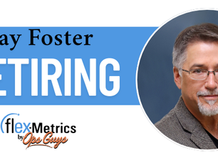The image announces the retirement of Jay Foster from Flex-Metrics. It features a blue and gray banner design with large white text reading “RETIRING” beneath Jay Foster’s name. On the right side is a professional headshot of Jay Foster wearing glasses and a blazer against a dark blue background. The Flex-Metrics Ops Guys logo appears in the lower left corner.