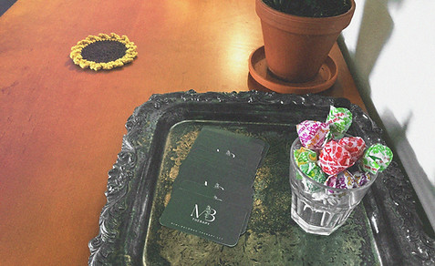 Small table with a simple flower vase creating a calm, welcoming atmosphere.